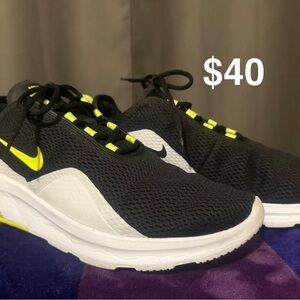 Black and White Nike Athletic Shoes with Neon Accents.